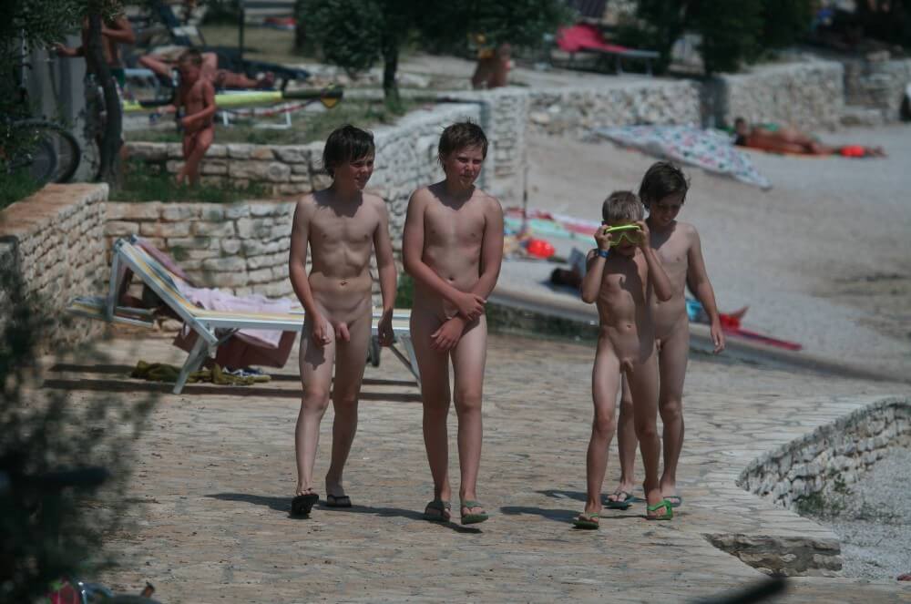 Shore walking nude - People come together in unity with nature to take off their clothes