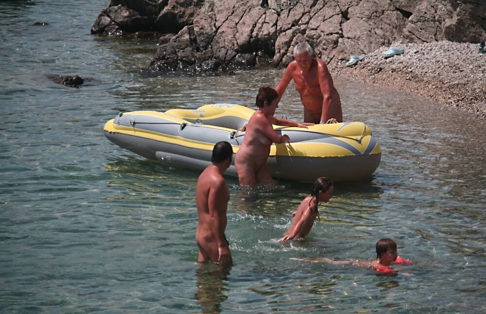Lone Nudist in Yellow Boat photos - Ordinary people as naturists