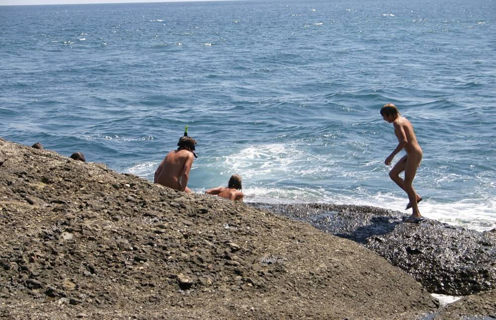 Leaning Against Hit Rocks pics - Naturism helps us understand the important fact that the body is part of nature