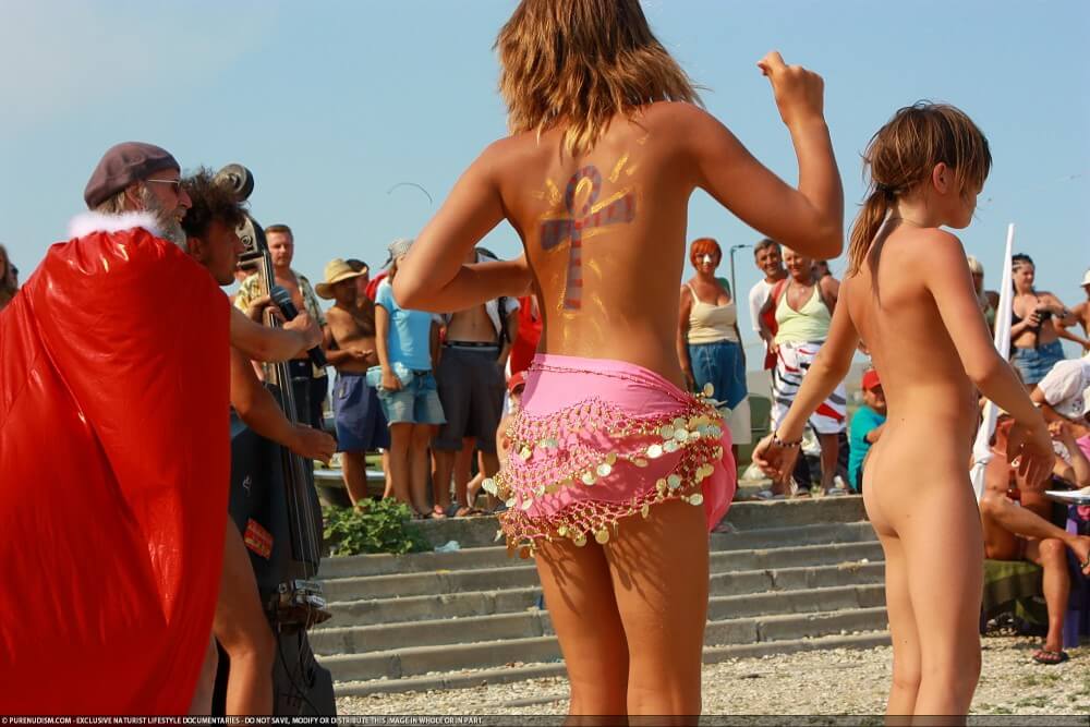 Colorful Carnival Dancing photos - A love of the sun and fresh air are important values for those who practice naturism and nudism